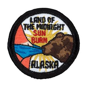 PATCH, EMBOSSED MERIT "LAND OF THE MIDNIGHT SUNBURN"